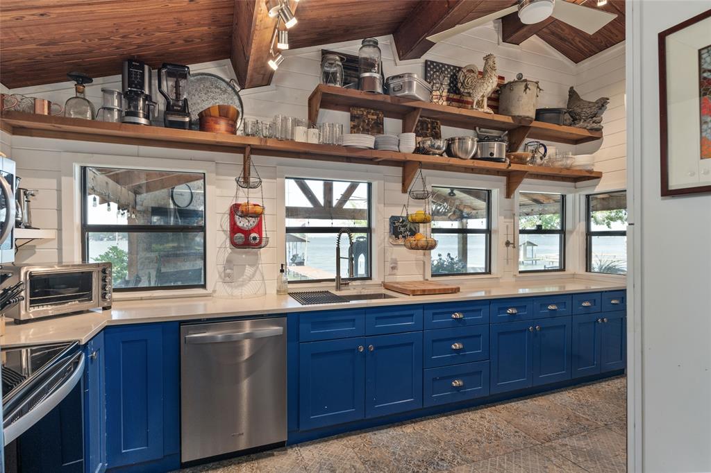 309 Shore Line Drive Tool, TX 75143 - Photo 8 of 23 a kitchen with lots of counter top space and wooden floor