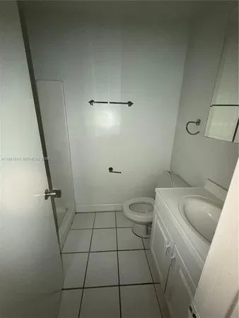 a bathroom with a sink and toilet