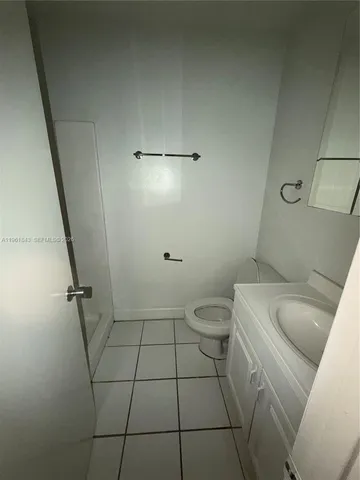 a bathroom with a sink and toilet