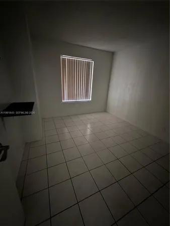 a view of a livingroom and window