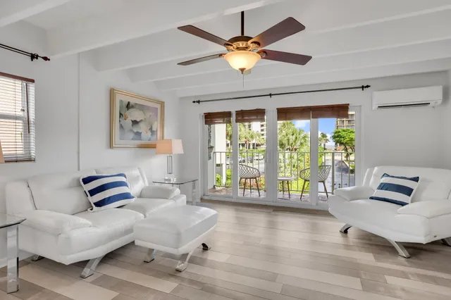 a bedroom with furniture and a large window
