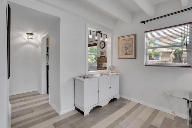 a room with a window and a mirror