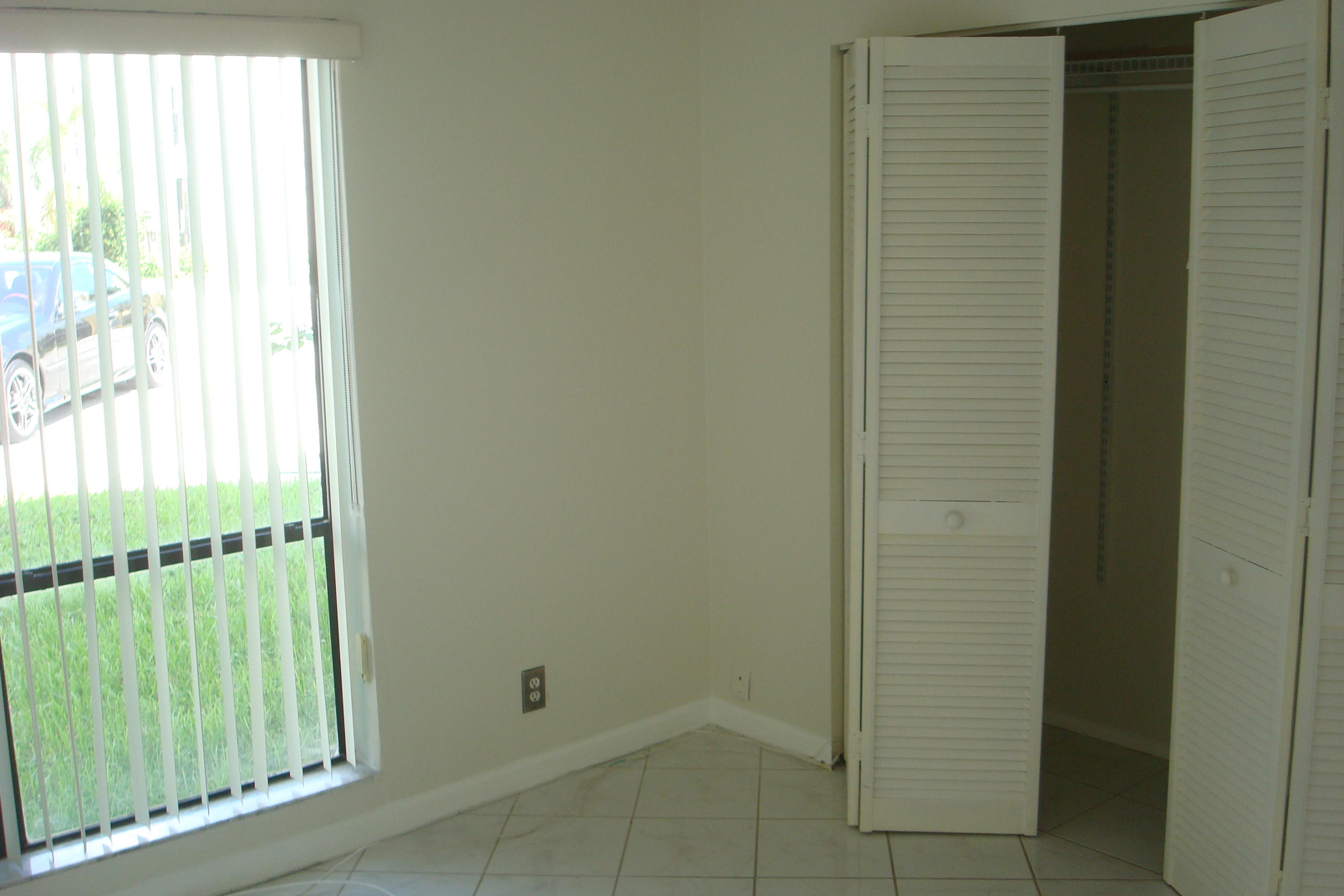517 Dotterel Road, Unit 30A Delray Beach, FL 33444 - Photo 15 of 32 a view of an empty room with windows