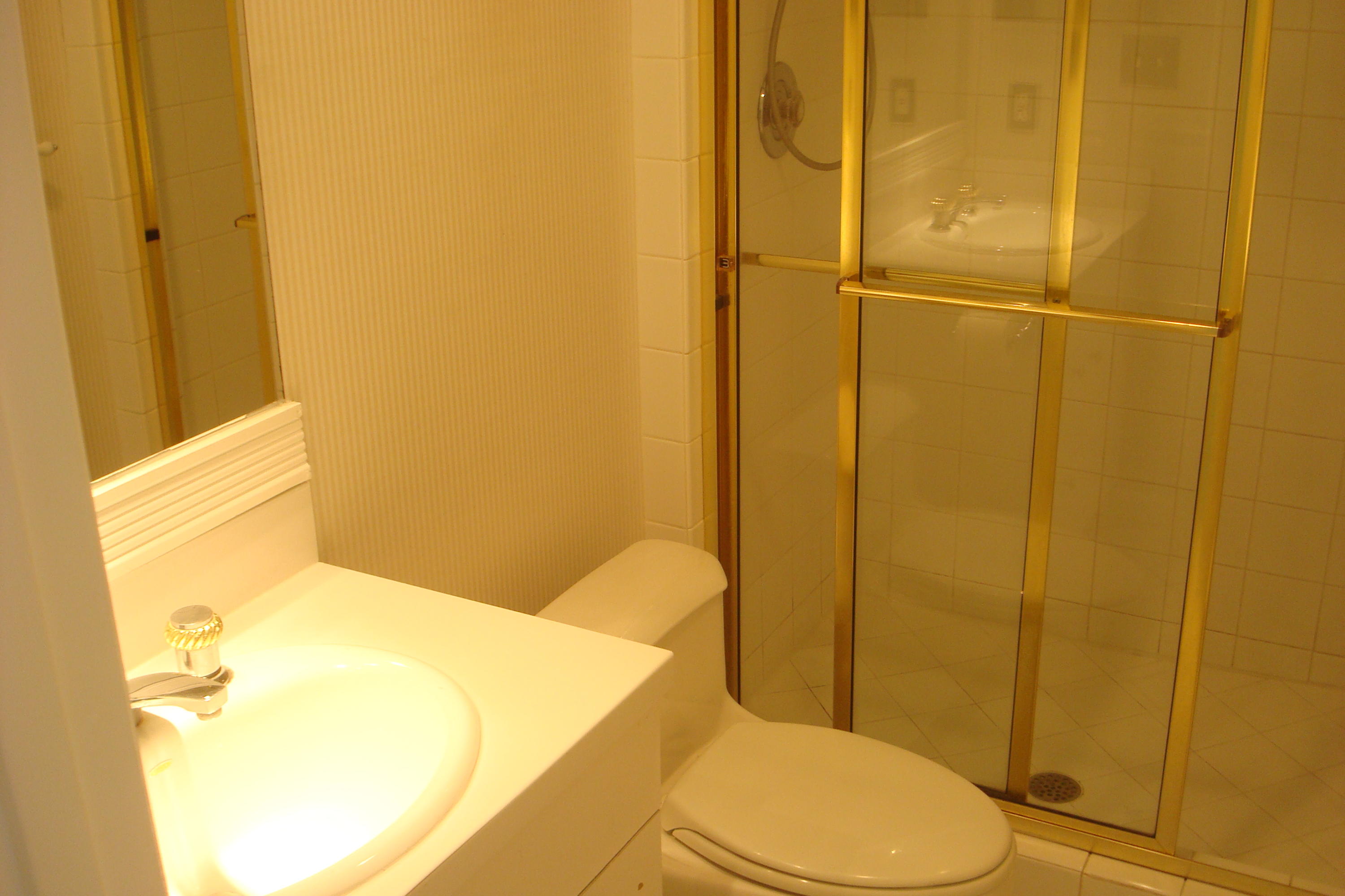 517 Dotterel Road, Unit 30A Delray Beach, FL 33444 - Photo 17 of 32 a bathroom with a toilet and shower