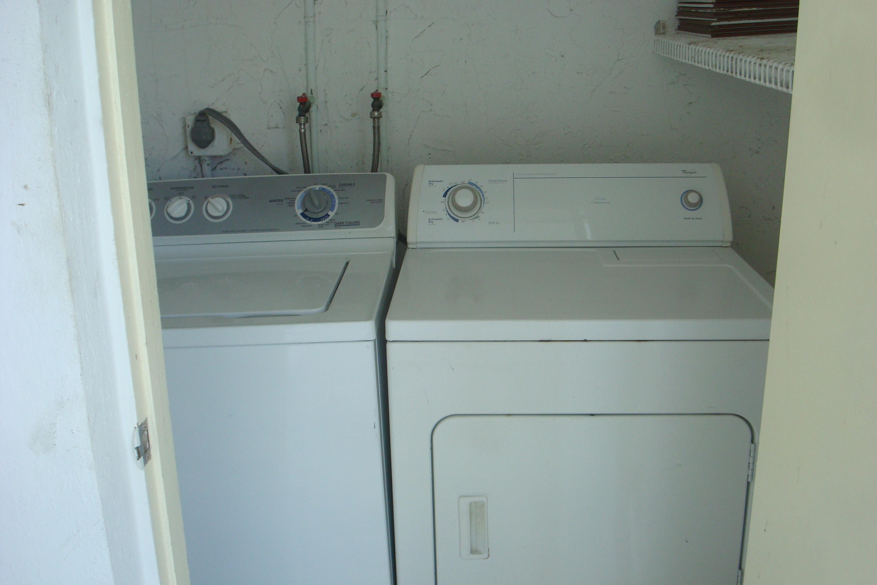 517 Dotterel Road, Unit 30A Delray Beach, FL 33444 - Photo 20 of 32 a close up view of a washer and dryer