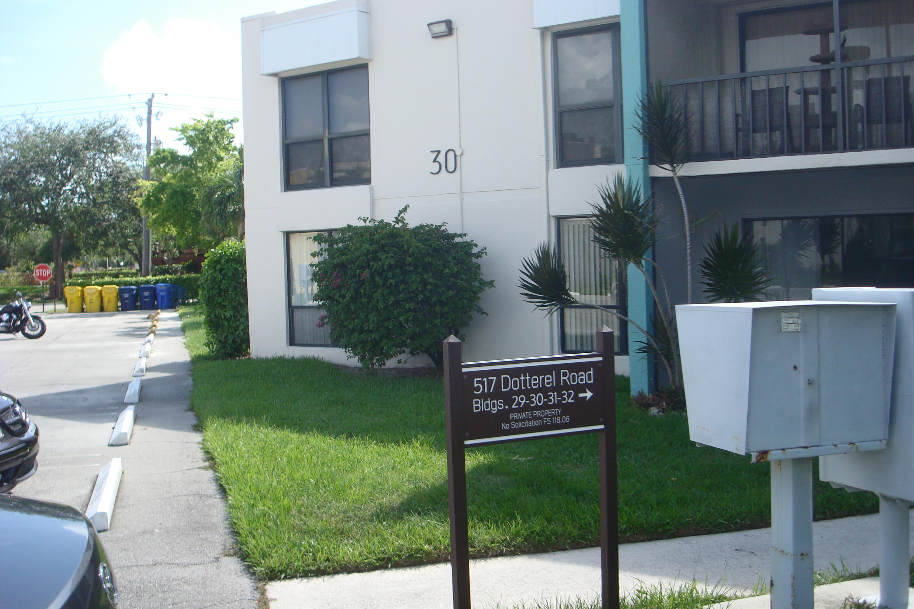 517 Dotterel Road, Unit 30A Delray Beach, FL 33444 - Photo 22 of 32 a view of a sign board with yard
