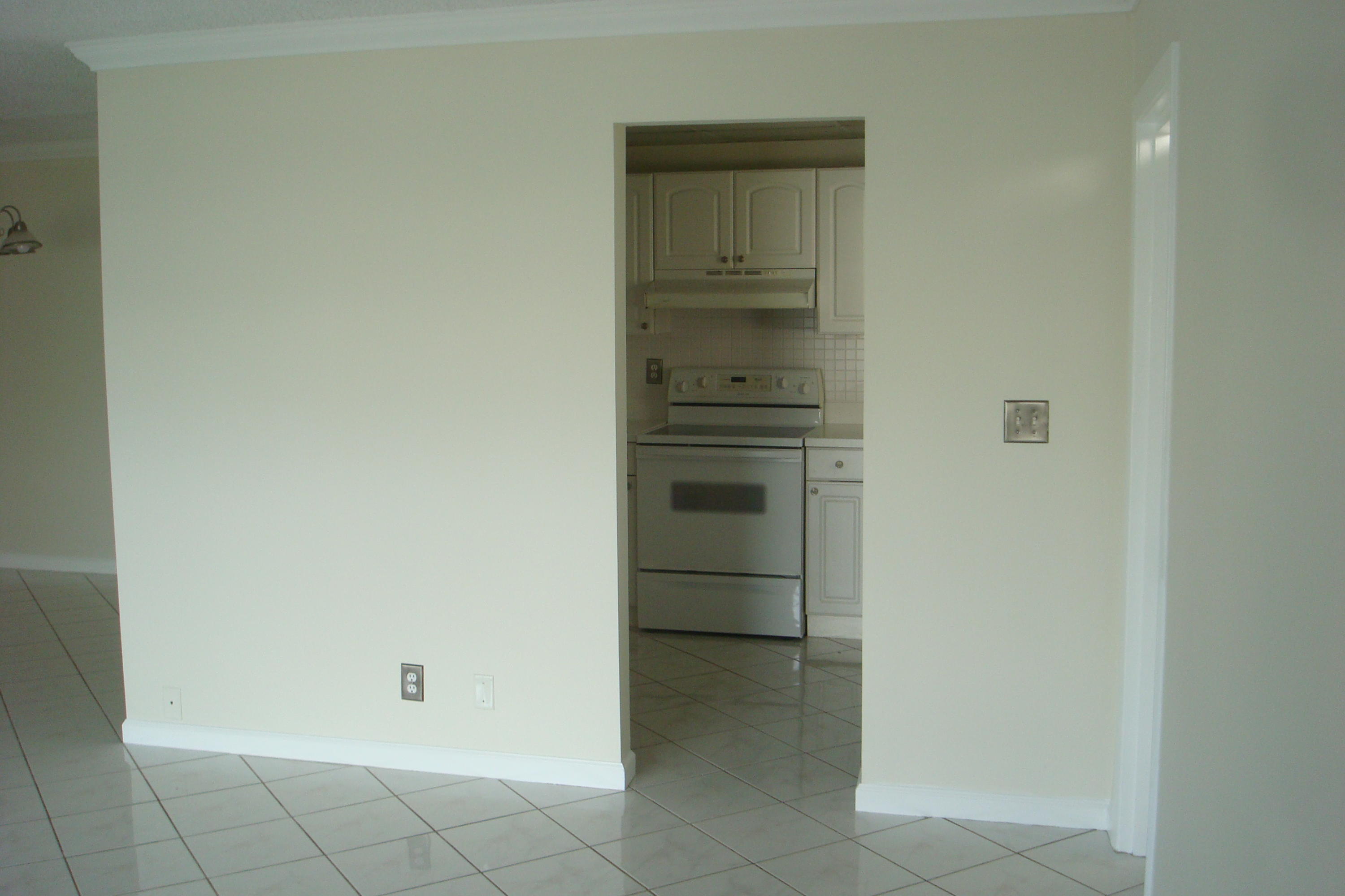 517 Dotterel Road, Unit 30A Delray Beach, FL 33444 - Photo 5 of 32 a room with a closet and a stove