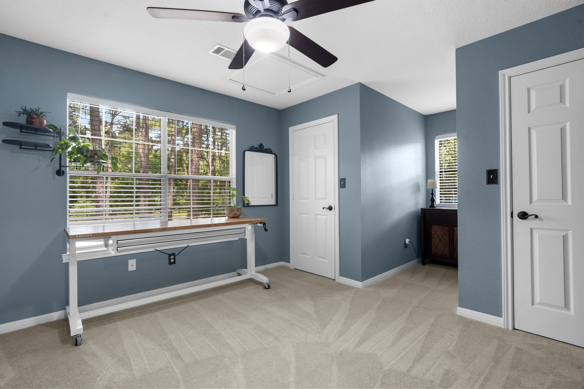 19610 Timber Ridge Drive Magnolia, TX 77355 - Photo 27 of 50 A cozy upstairs secondary bedroom features brand new, soft carpet, large windows, and the convenience of double closets offering generous storage space.