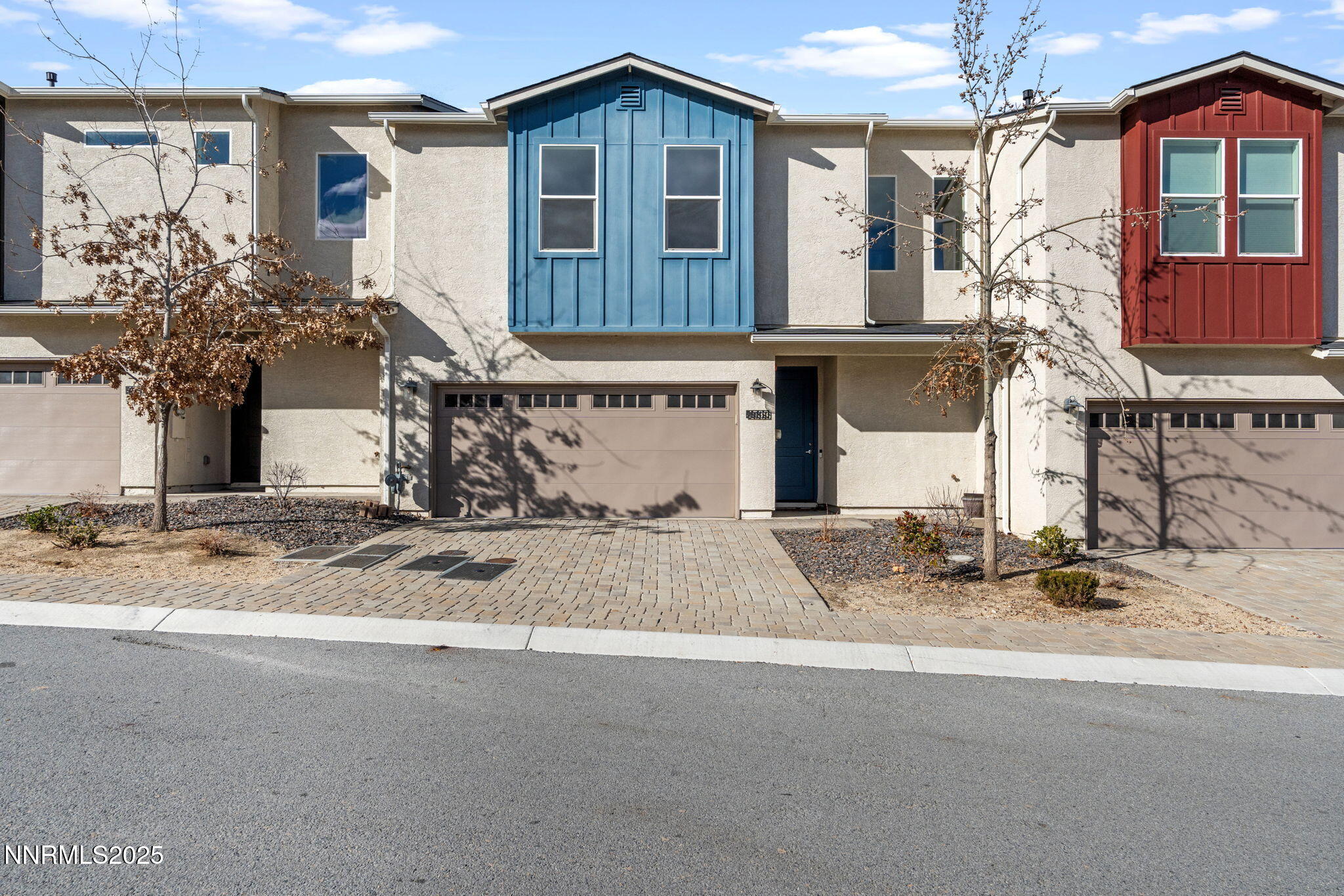 4589 Falcon Rock Lane Sun Valley, NV 89433 - Photo 1 of 26 a front view of a house with a yard garage and window
