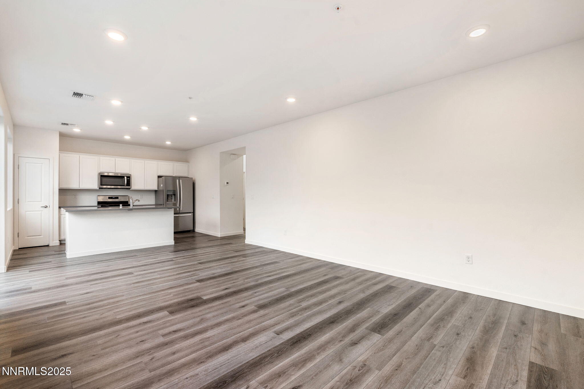 4589 Falcon Rock Lane Sun Valley, NV 89433 - Photo 13 of 26 a view of kitchen dining space with wooden floor