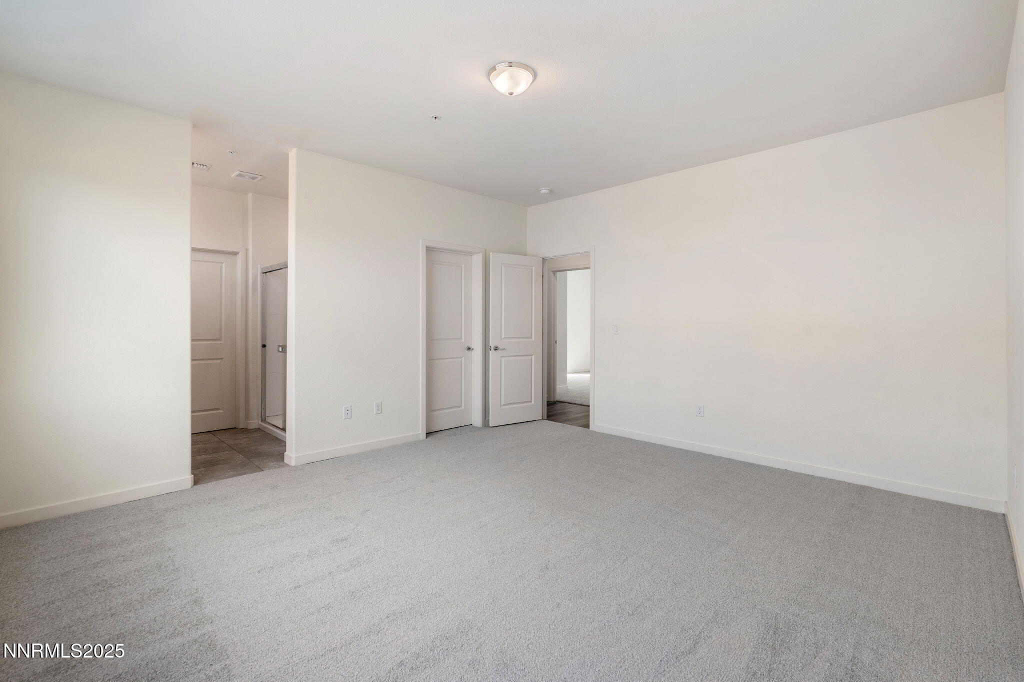 4589 Falcon Rock Lane Sun Valley, NV 89433 - Photo 19 of 26 an empty room with an entryway