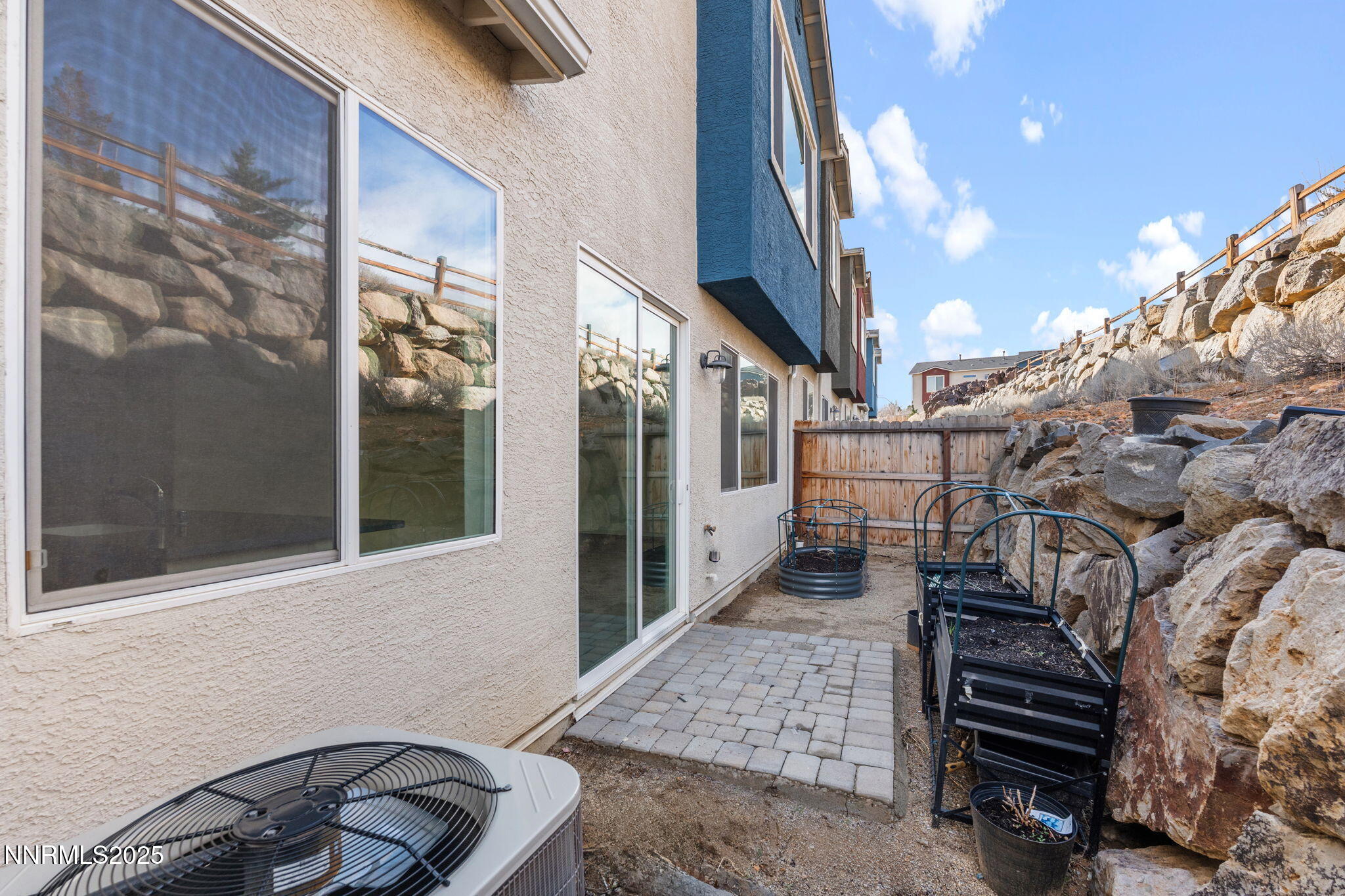 4589 Falcon Rock Lane Sun Valley, NV 89433 - Photo 24 of 26 a view of a patio with wooden floor and fence
