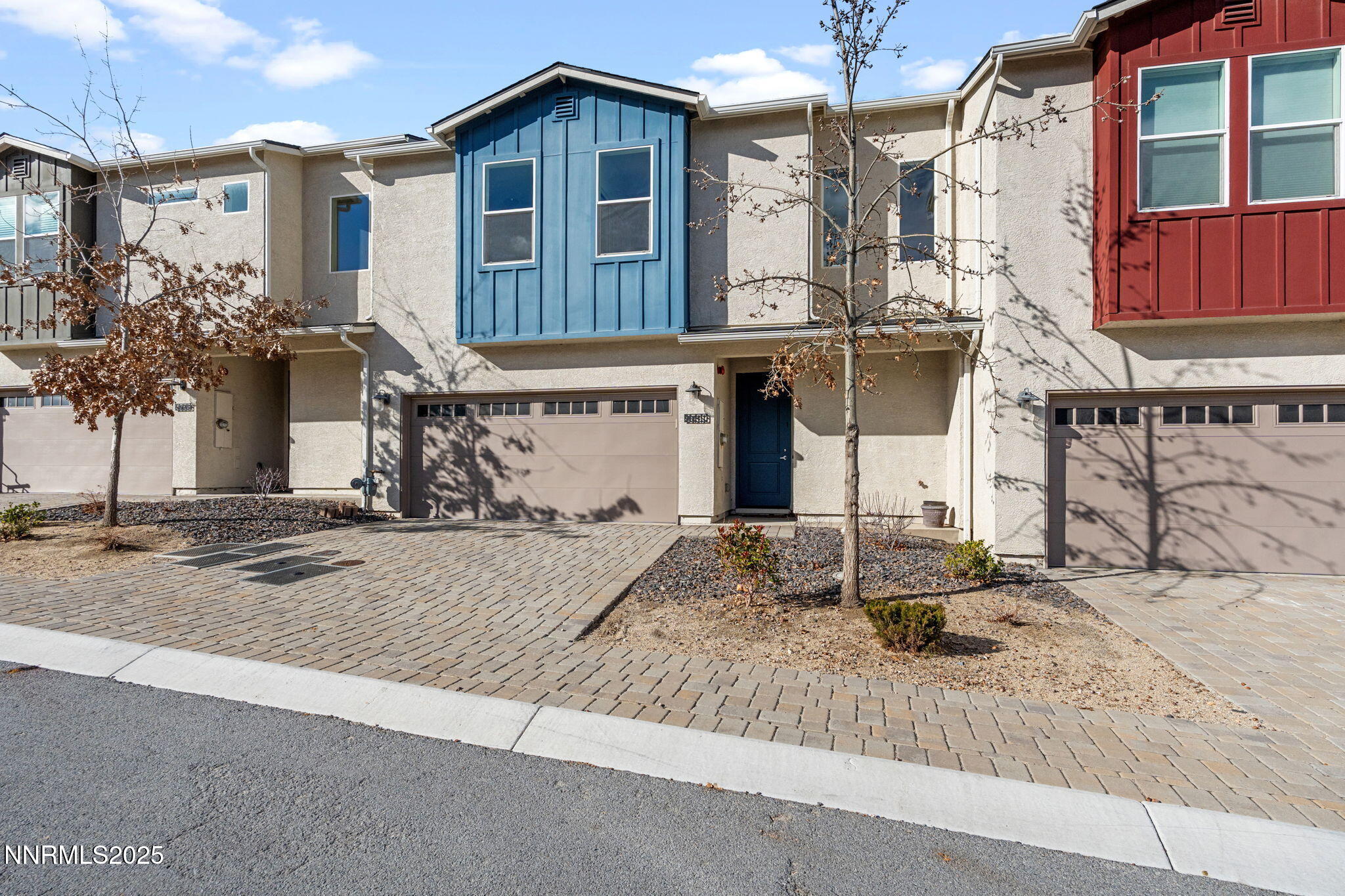 4589 Falcon Rock Lane Sun Valley, NV 89433 - Photo 4 of 26 a front view of a house with street