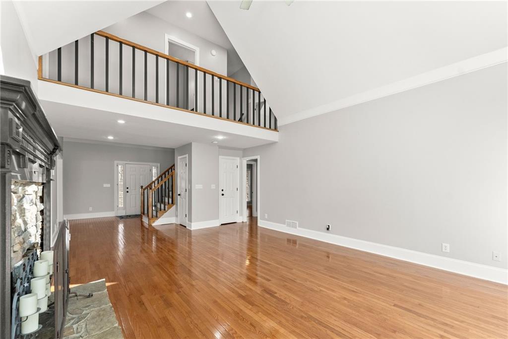 3523 Lighthouse Lane Gainesville, GA 30504 - Photo 13 of 72 a view of a hallway with wooden floor and staircase
