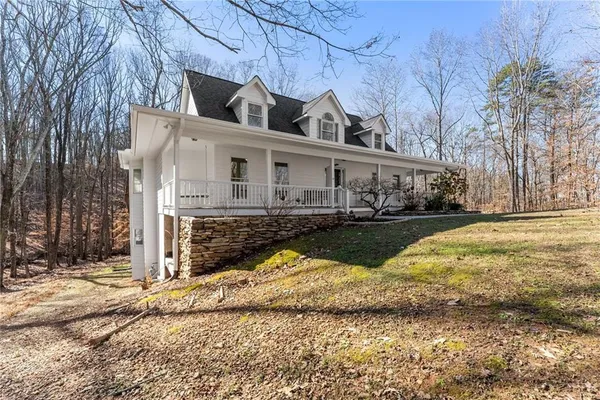 a view of house with outdoor space