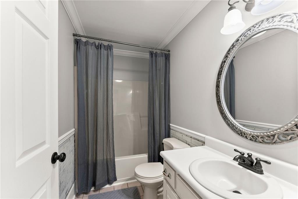 3523 Lighthouse Lane Gainesville, GA 30504 - Photo 31 of 72 a bathroom with a sink a toilet and a mirror