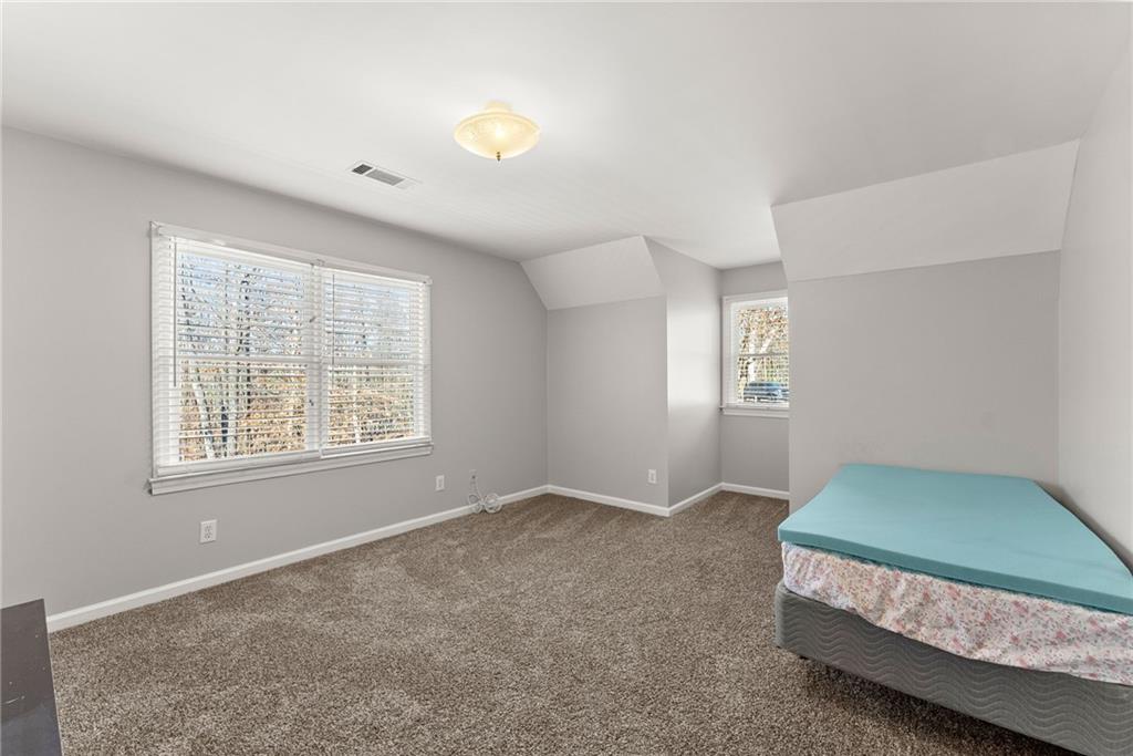 3523 Lighthouse Lane Gainesville, GA 30504 - Photo 40 of 72 a bedroom with bed and window