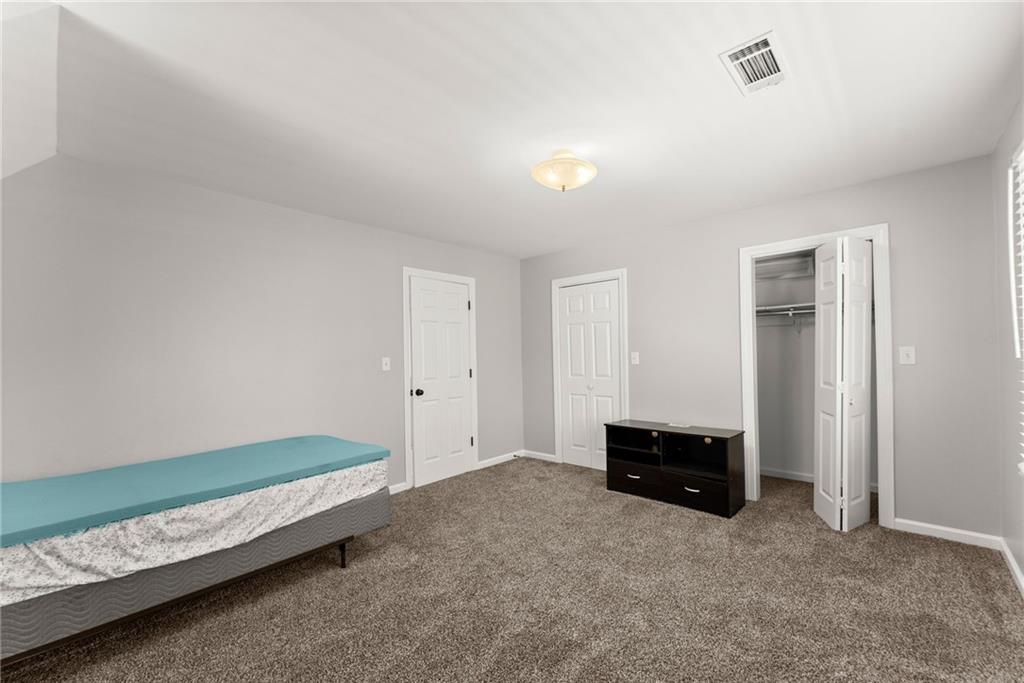 3523 Lighthouse Lane Gainesville, GA 30504 - Photo 41 of 72 a living room with a bed and a window