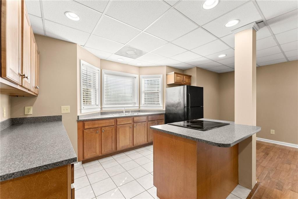 3523 Lighthouse Lane Gainesville, GA 30504 - Photo 53 of 72 a kitchen with stainless steel appliances granite countertop a sink stove and refrigerator