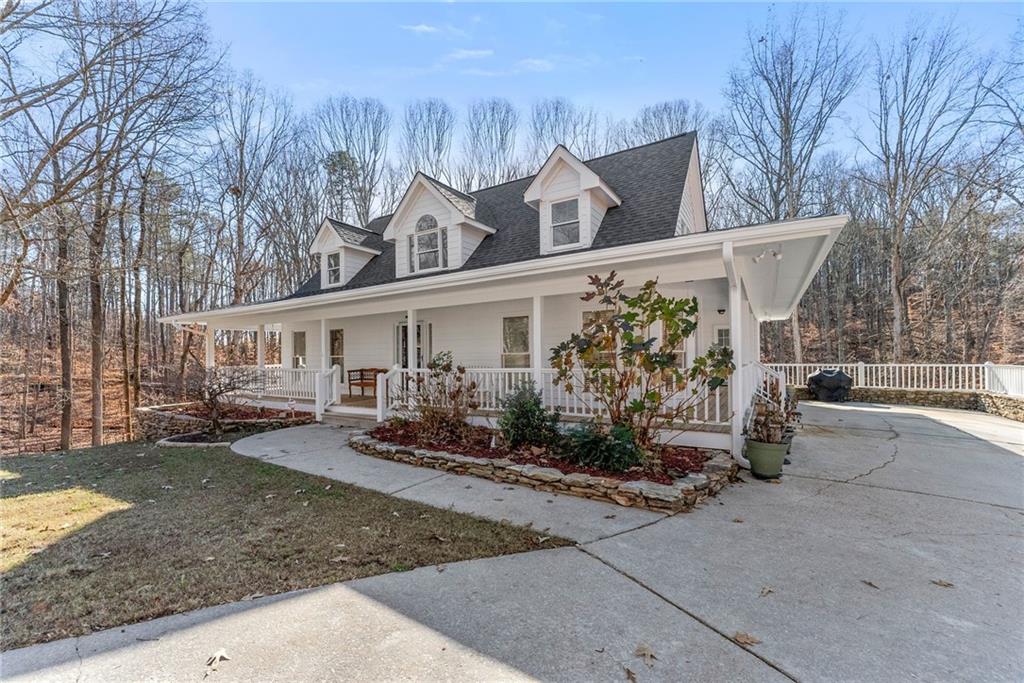3523 Lighthouse Lane Gainesville, GA 30504 - Photo 6 of 72 a view of a house with a yard covered in snow
