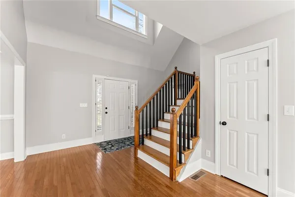 a view of a dining room with furniture and wooden floor