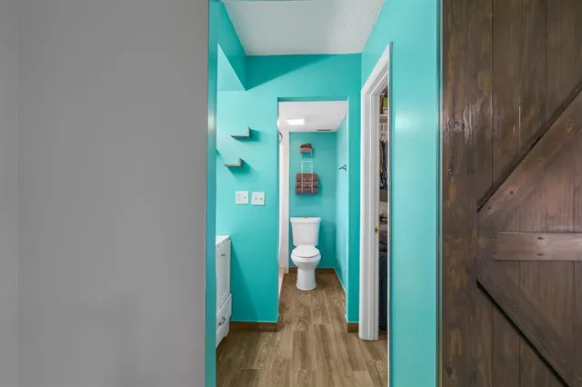 a bathroom with a shower and a toilet