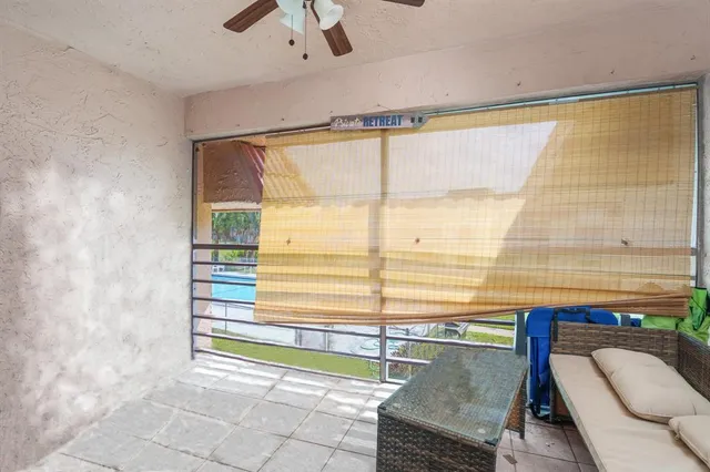 a swimming pool with the view of trees in the background