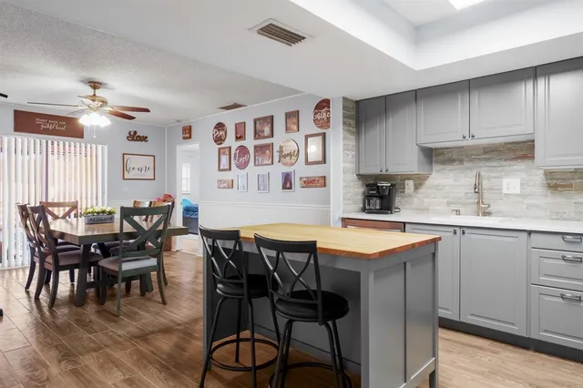 a kitchen that has a table and chairs in it