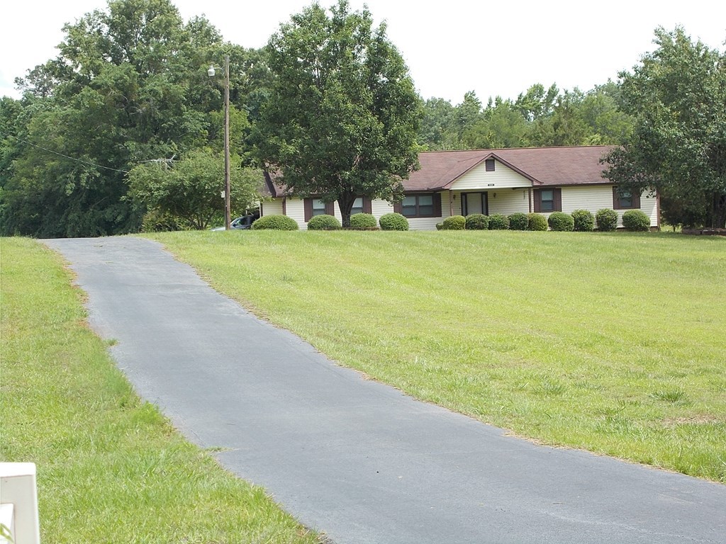 2972 Graham Road Gray, GA 31032 - Photo 3 of 29 a front view of a house with yard and green space