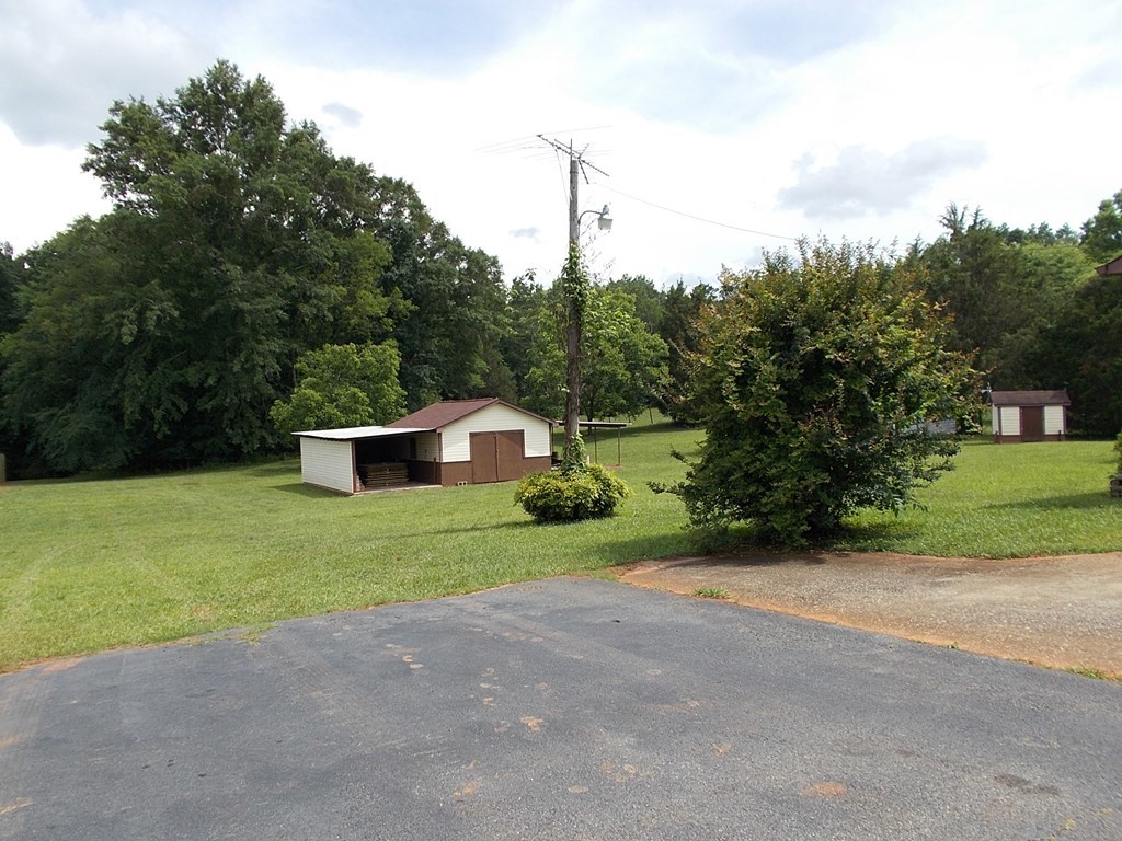 2972 Graham Road Gray, GA 31032 - Photo 8 of 29 a front view of a house with a yard and garage