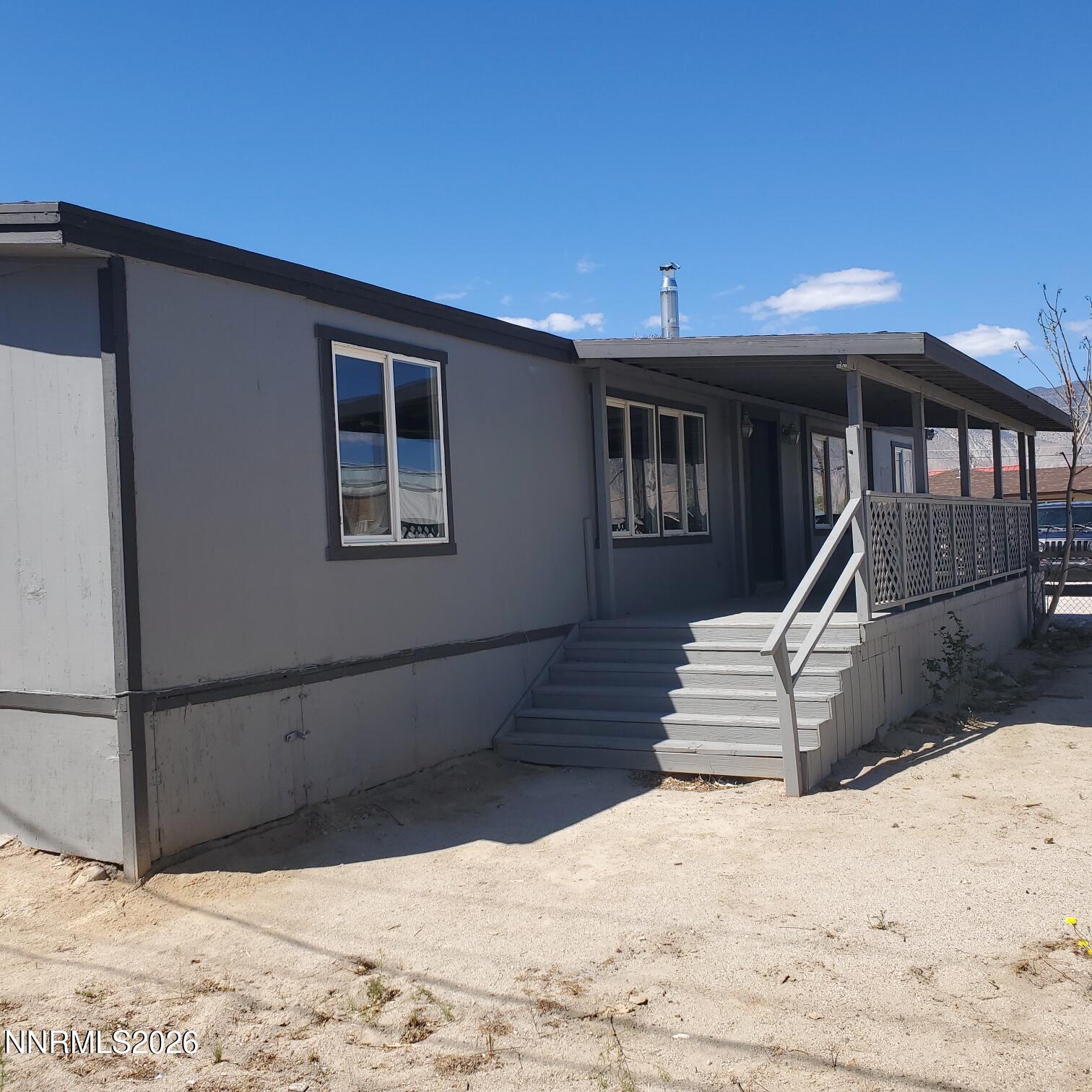 440 N Street Hawthorne, NV 89415 - Photo 1 of 34 a front view of a house with a yard