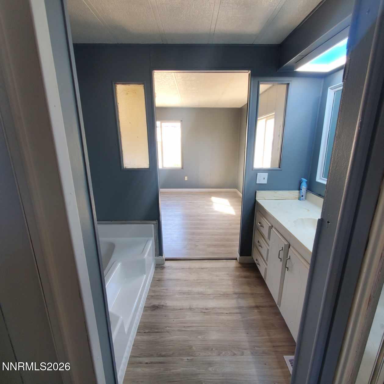 440 N Street Hawthorne, NV 89415 - Photo 12 of 34 a bathroom with a sink a mirror and a bathtub