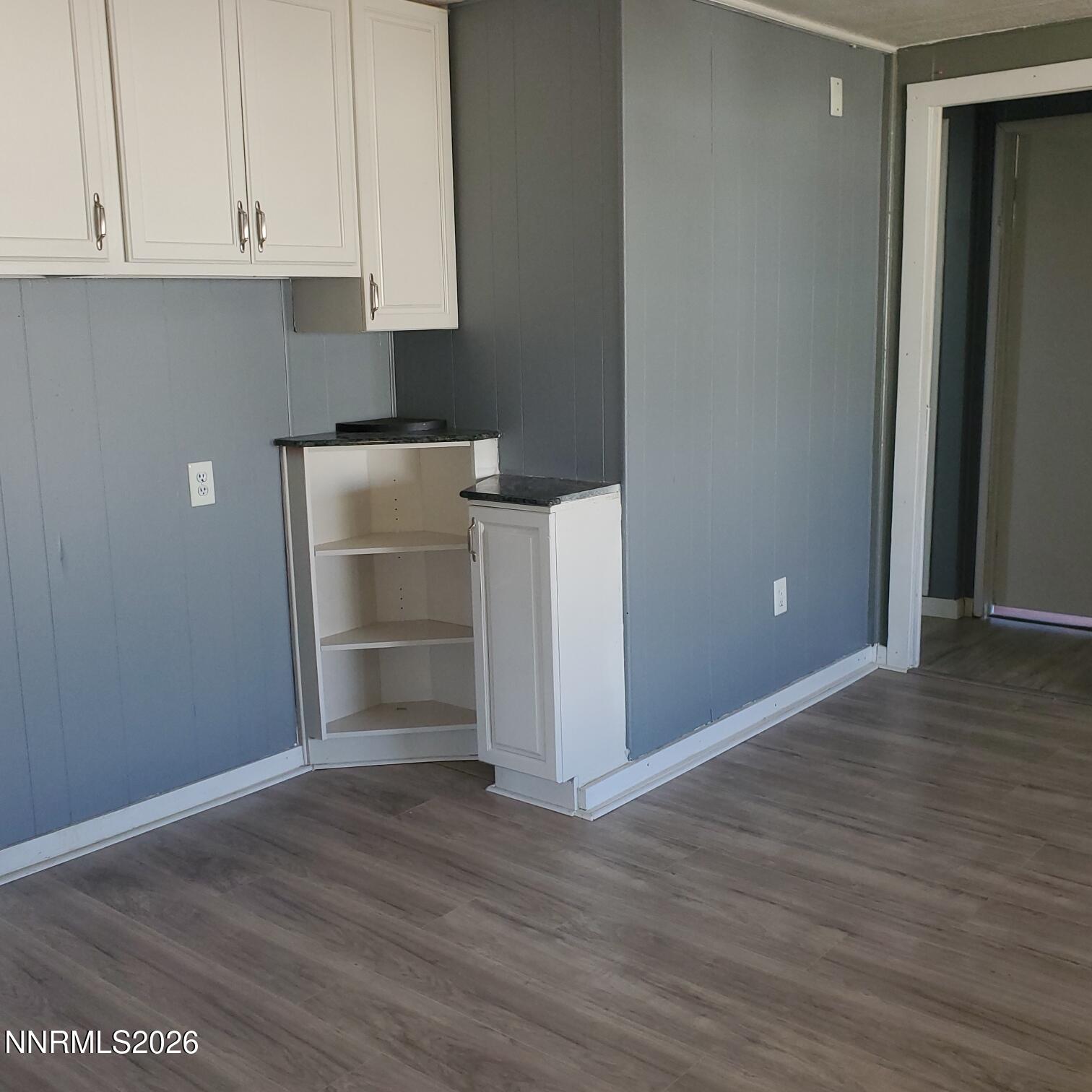 440 N Street Hawthorne, NV 89415 - Photo 13 of 34 a view of an empty room with wooden floor and cabinet