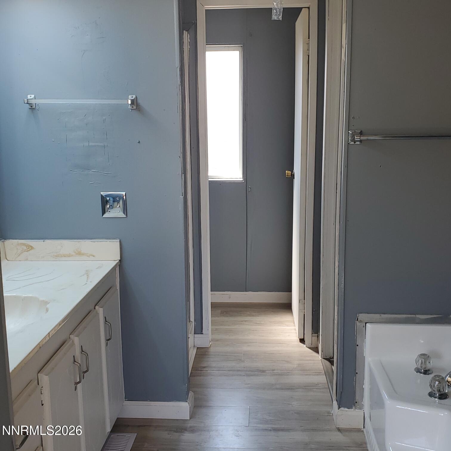 440 N Street Hawthorne, NV 89415 - Photo 18 of 34 a bathroom with a granite countertop sink
