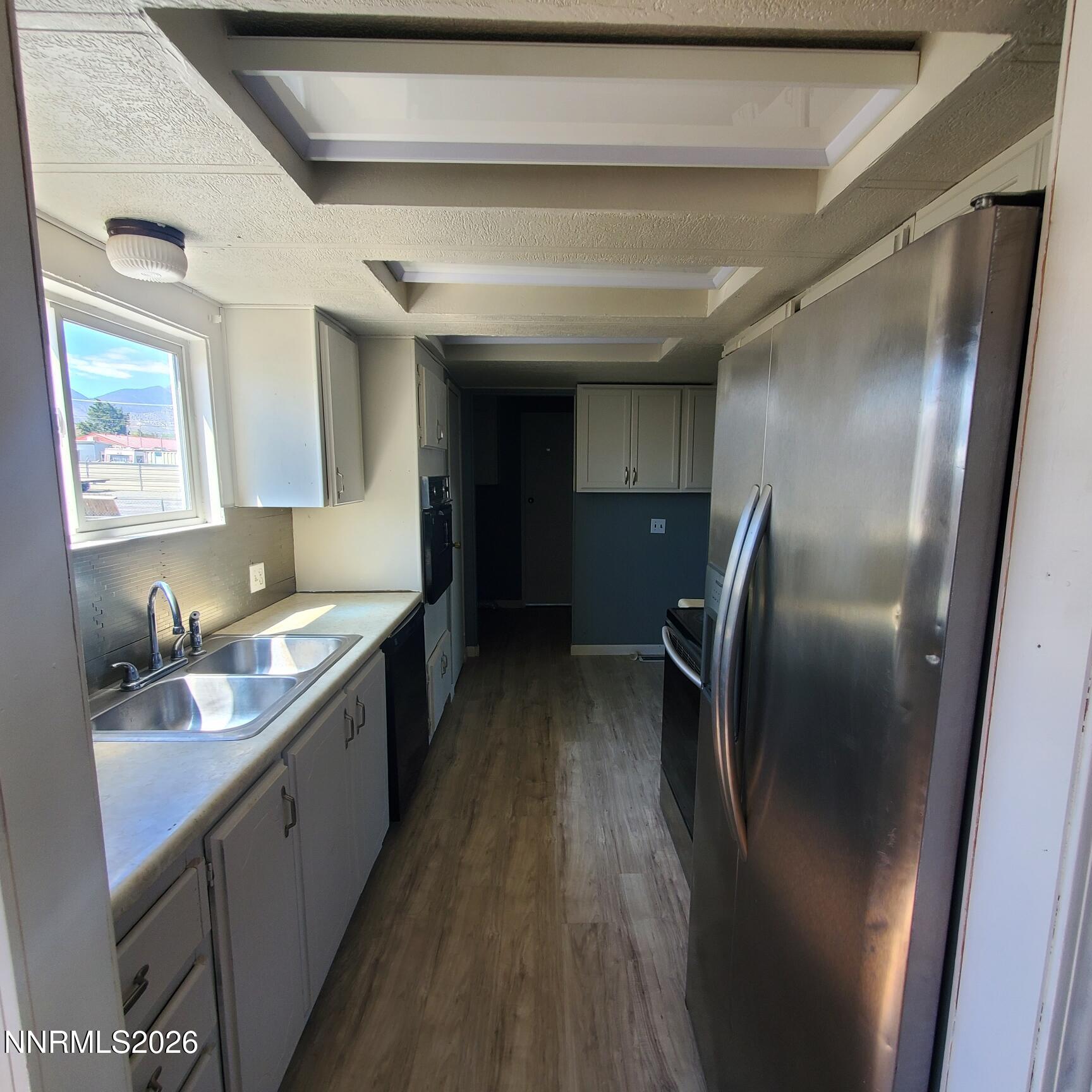 440 N Street Hawthorne, NV 89415 - Photo 2 of 34 a kitchen with stainless steel appliances granite countertop a refrigerator a sink a stove and dishwasher