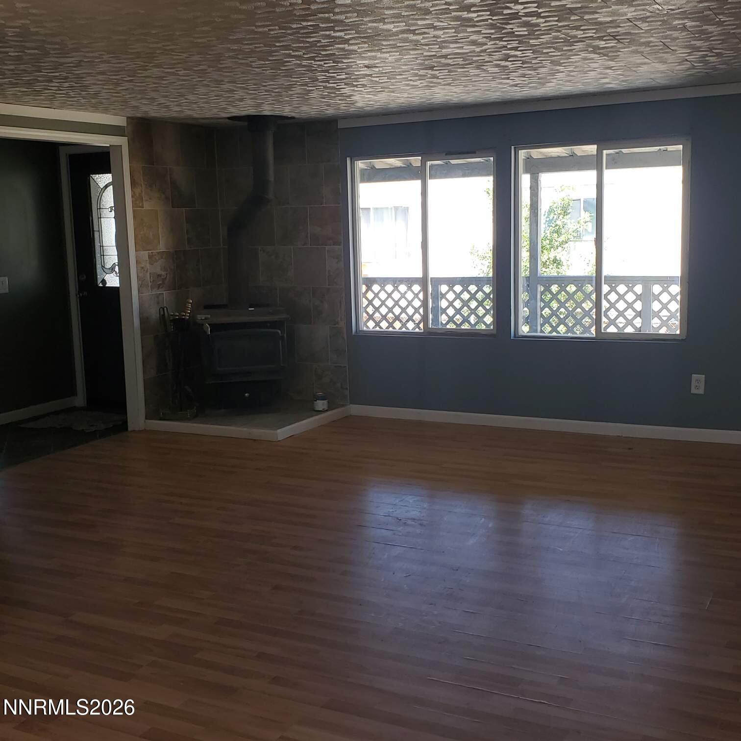 440 N Street Hawthorne, NV 89415 - Photo 22 of 34 an empty room with wooden floor and windows