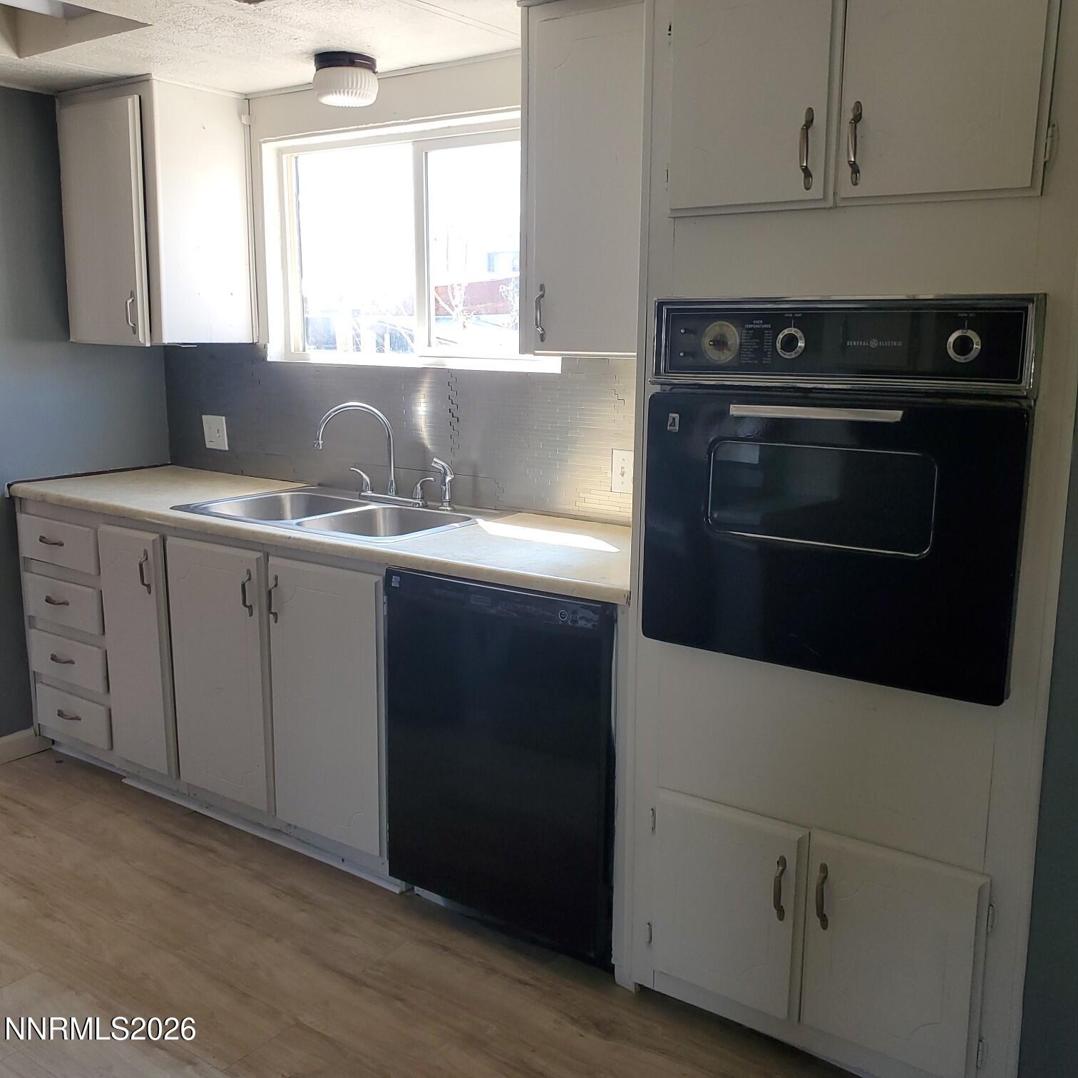 440 N Street Hawthorne, NV 89415 - Photo 24 of 34 a kitchen with stainless steel appliances a sink stove and cabinets