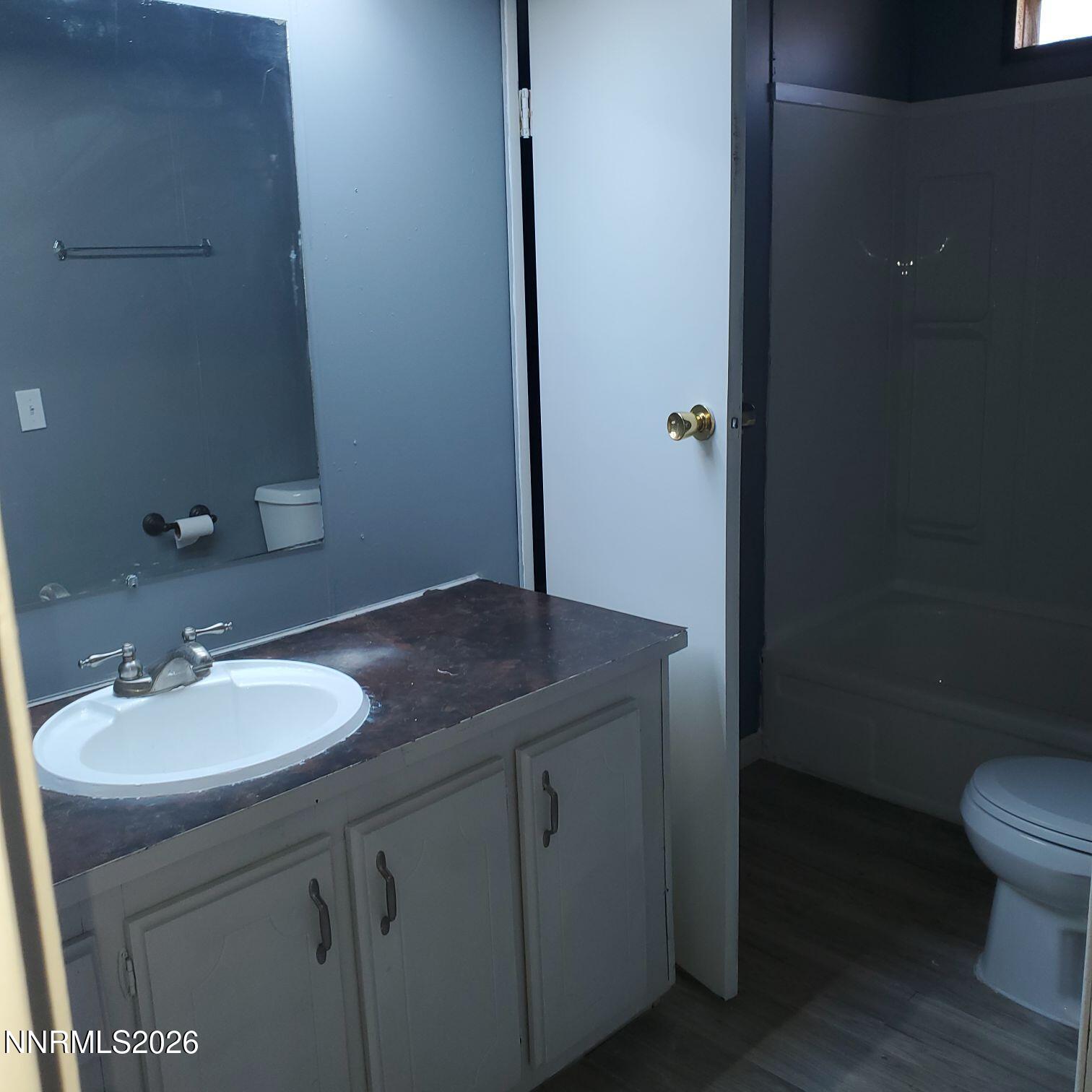 440 N Street Hawthorne, NV 89415 - Photo 26 of 34 a bathroom with a granite countertop sink and a mirror