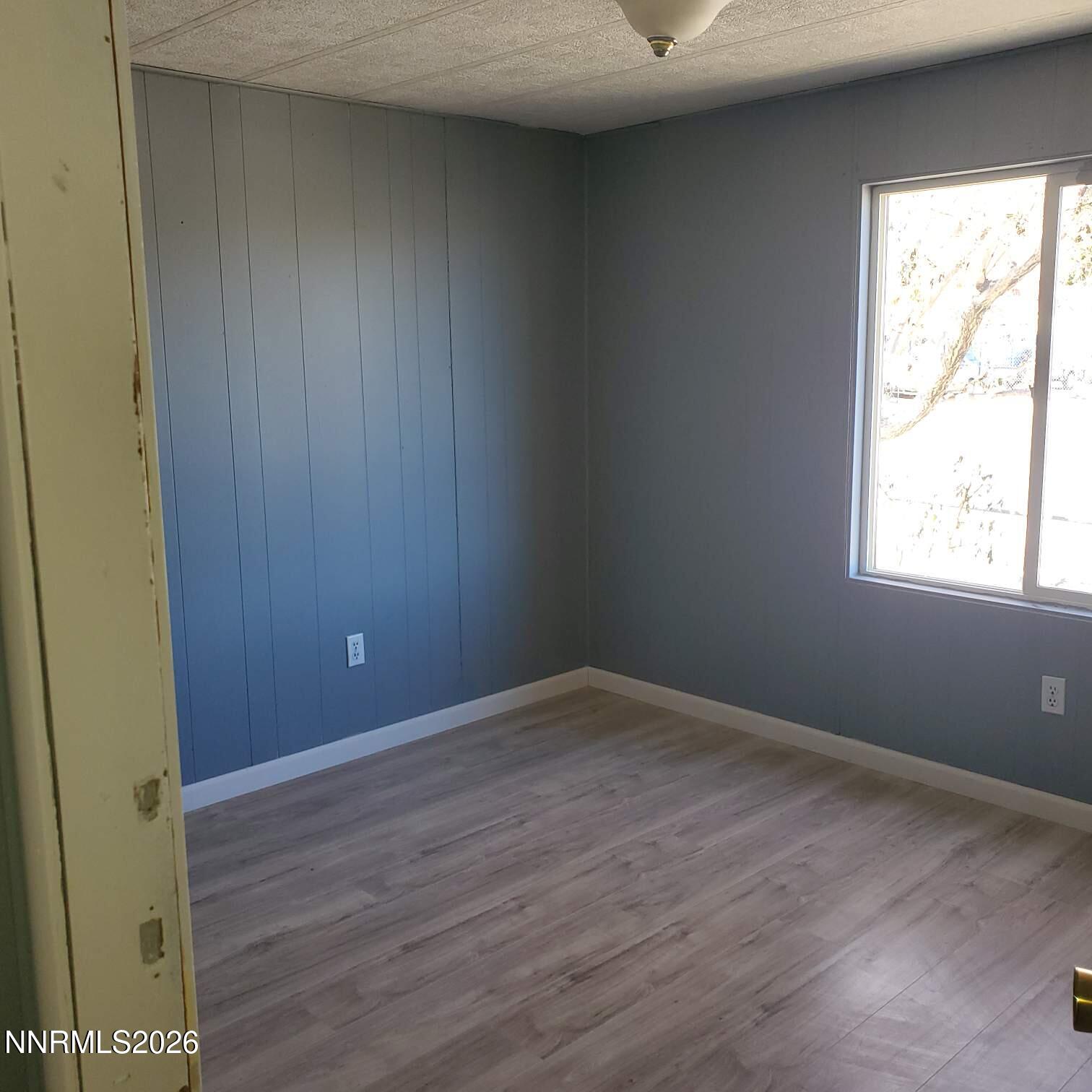440 N Street Hawthorne, NV 89415 - Photo 28 of 34 an empty room with wooden floor and windows