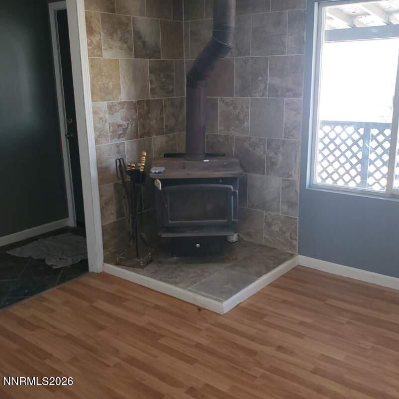 440 N Street Hawthorne, NV 89415 - Photo 3 of 34 a view of an empty room with wooden floor and a window