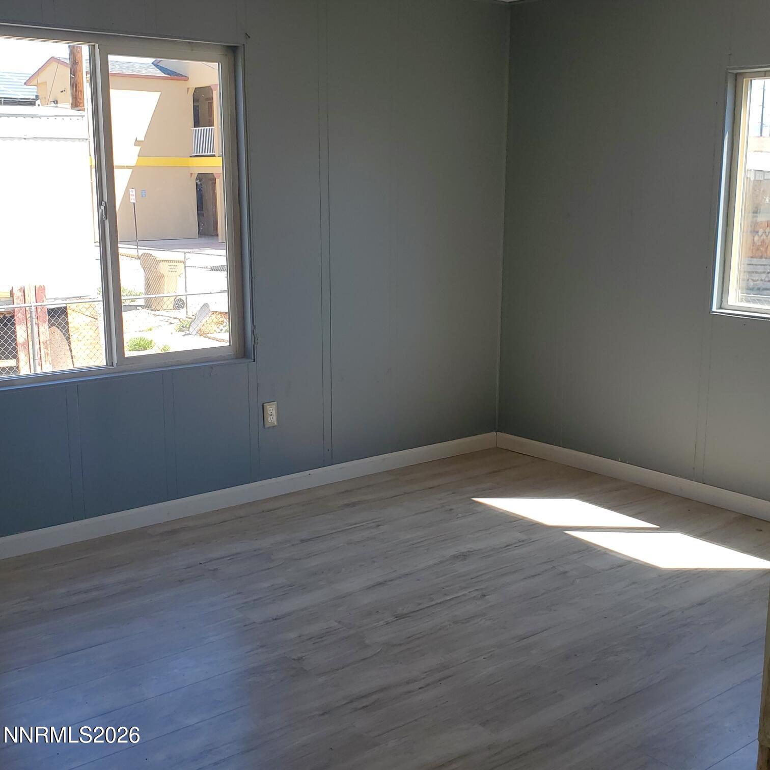 440 N Street Hawthorne, NV 89415 - Photo 4 of 34 a view of an empty room with wooden floor and a window