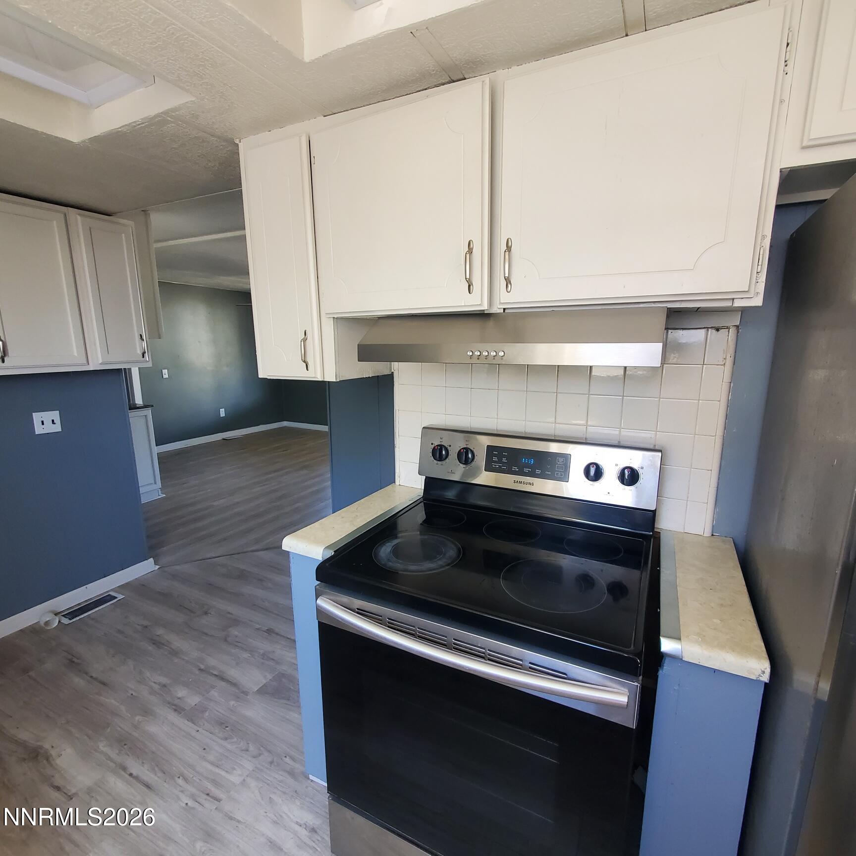 440 N Street Hawthorne, NV 89415 - Photo 5 of 34 a stove top oven sitting inside of a kitchen
