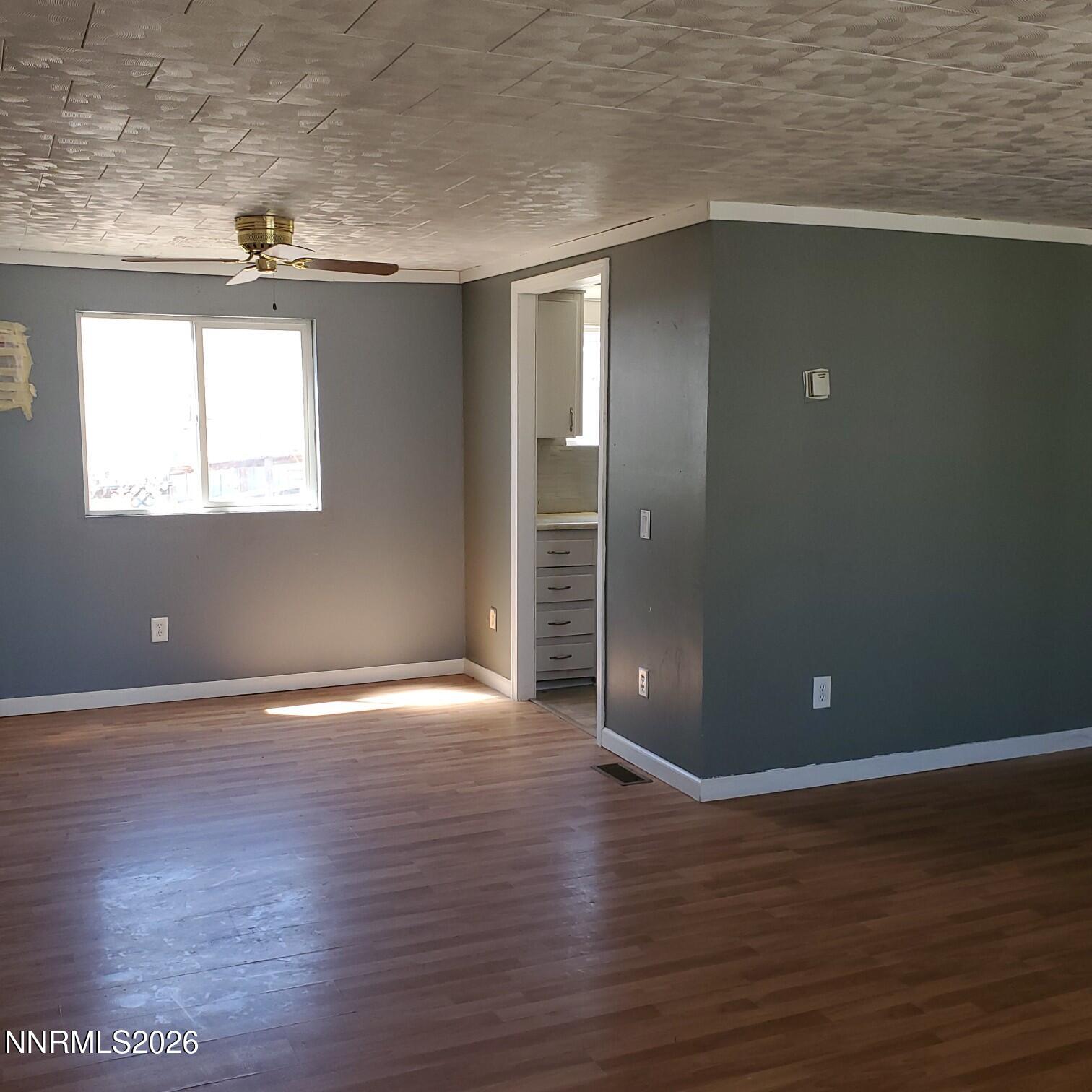 440 N Street Hawthorne, NV 89415 - Photo 6 of 34 an empty room with wooden floor and windows