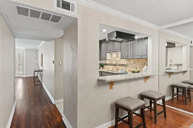 a view of a kitchen from the hallway