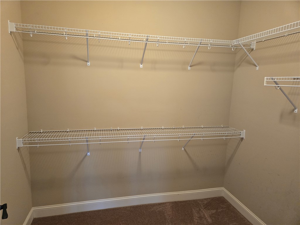 304 Knoll View Drive Seneca, SC 29678 - Photo 13 of 36 This spacious closet offers ample storage with convenient wire shelving, optimizing organization.