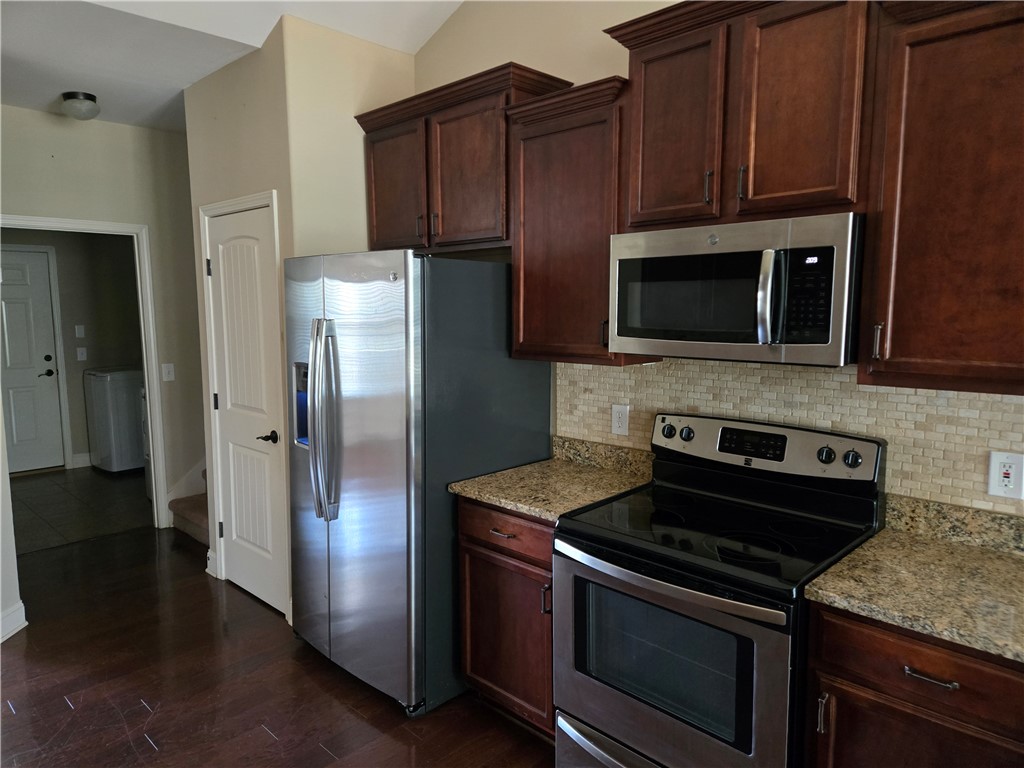 304 Knoll View Drive Seneca, SC 29678 - Photo 14 of 36 This functional kitchen features rich cabinetry, providing ample storage for culinary essentials.
