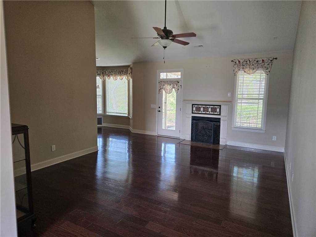304 Knoll View Drive Seneca, SC 29678 - Photo 16 of 36 This inviting space features lustrous hardwood flooring, a cozy fireplace, and abundant natural light.
