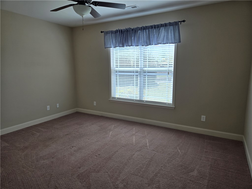 304 Knoll View Drive Seneca, SC 29678 - Photo 21 of 36 This spacious bedroom offers comfortable carpeting and natural light for a serene retreat.