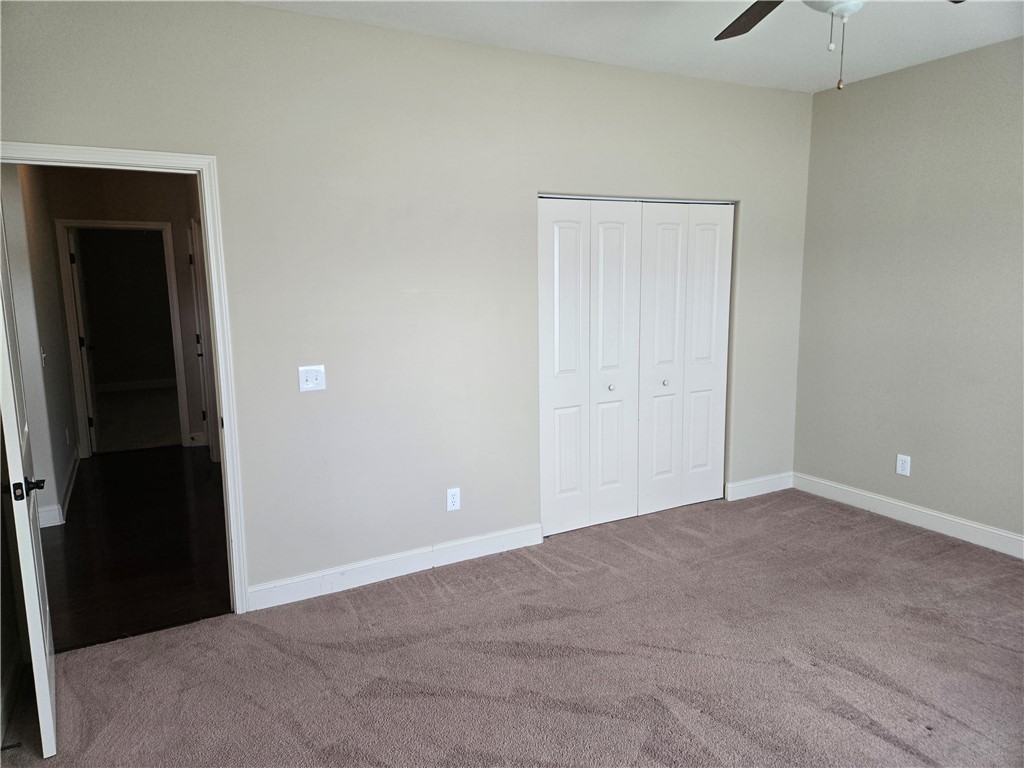 304 Knoll View Drive Seneca, SC 29678 - Photo 22 of 36 This spacious bedroom offers comfortable carpeting and convenient closet access.