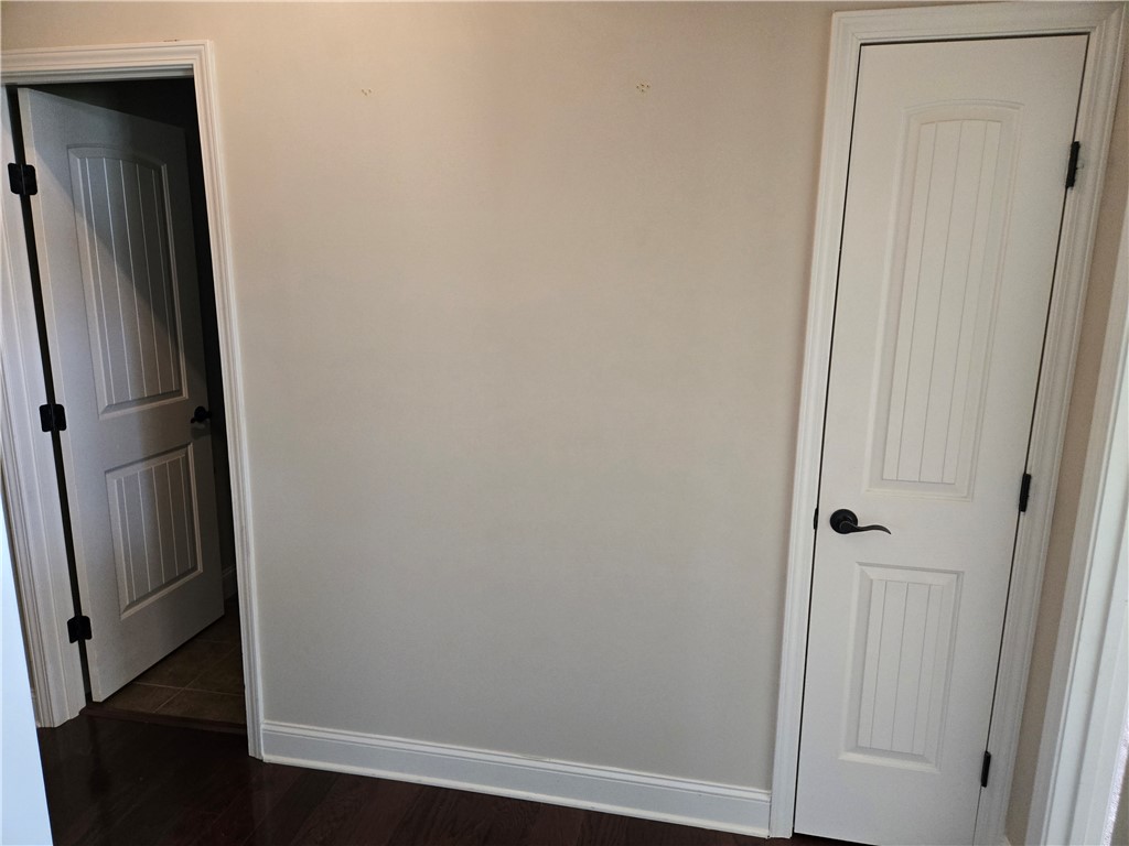 304 Knoll View Drive Seneca, SC 29678 - Photo 24 of 36 This interior showcases durable hardwood flooring and classic white paneled doors.